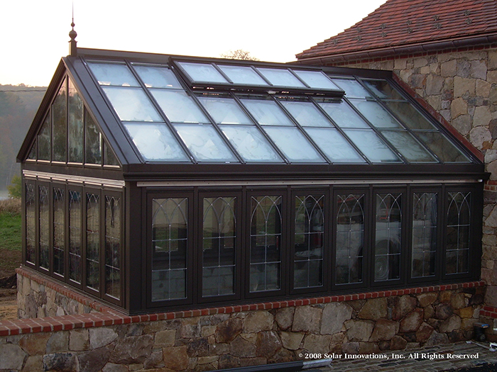 custom residential greenhouse with integrated ridge vent by Solar Innovations, Inc.