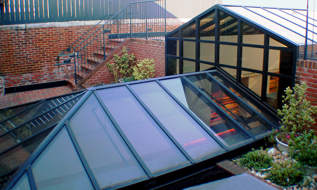 Straight eave double pitch multi-tier skylight with a hip end