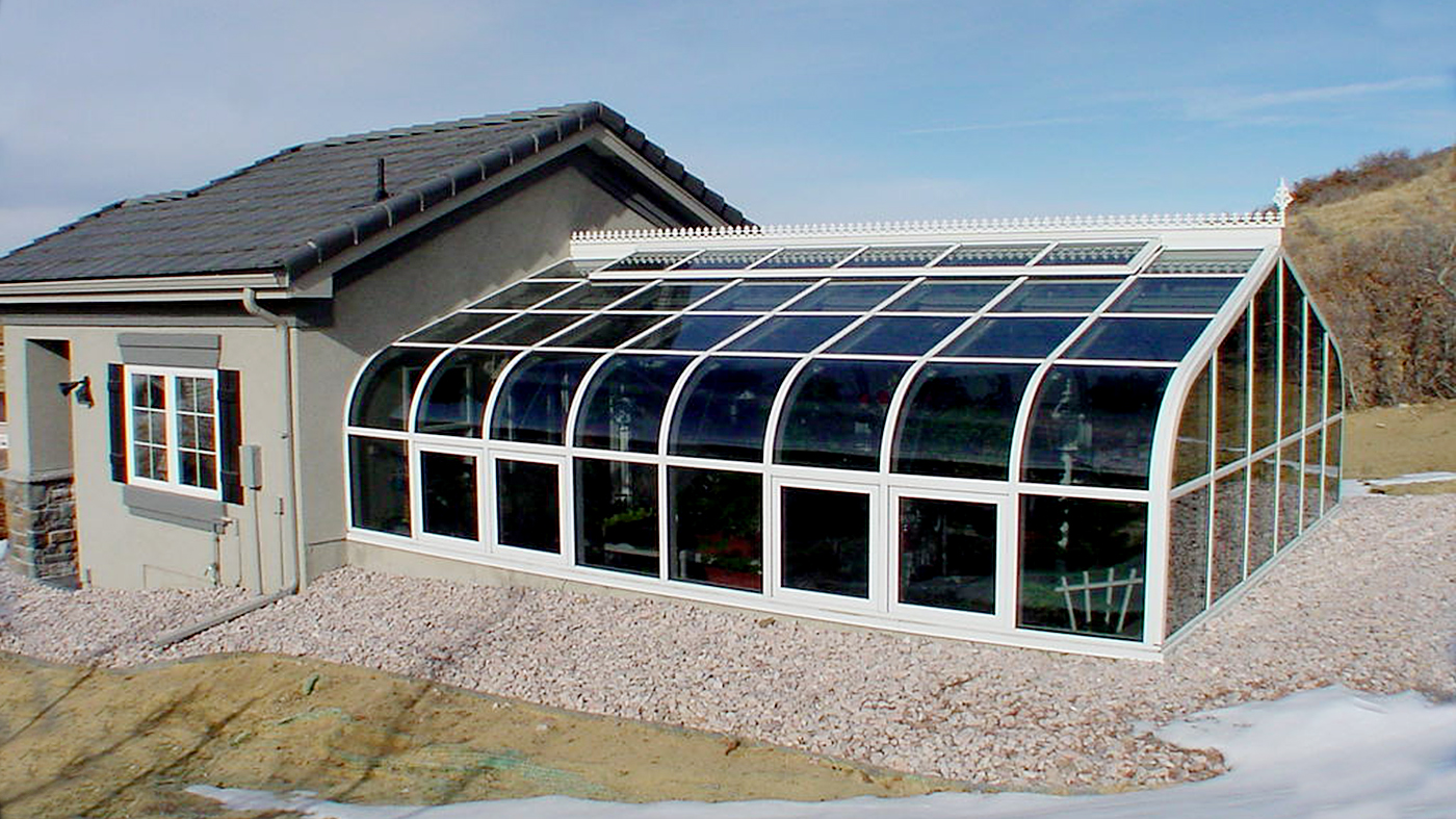 Curved eave double pitch greenhouse