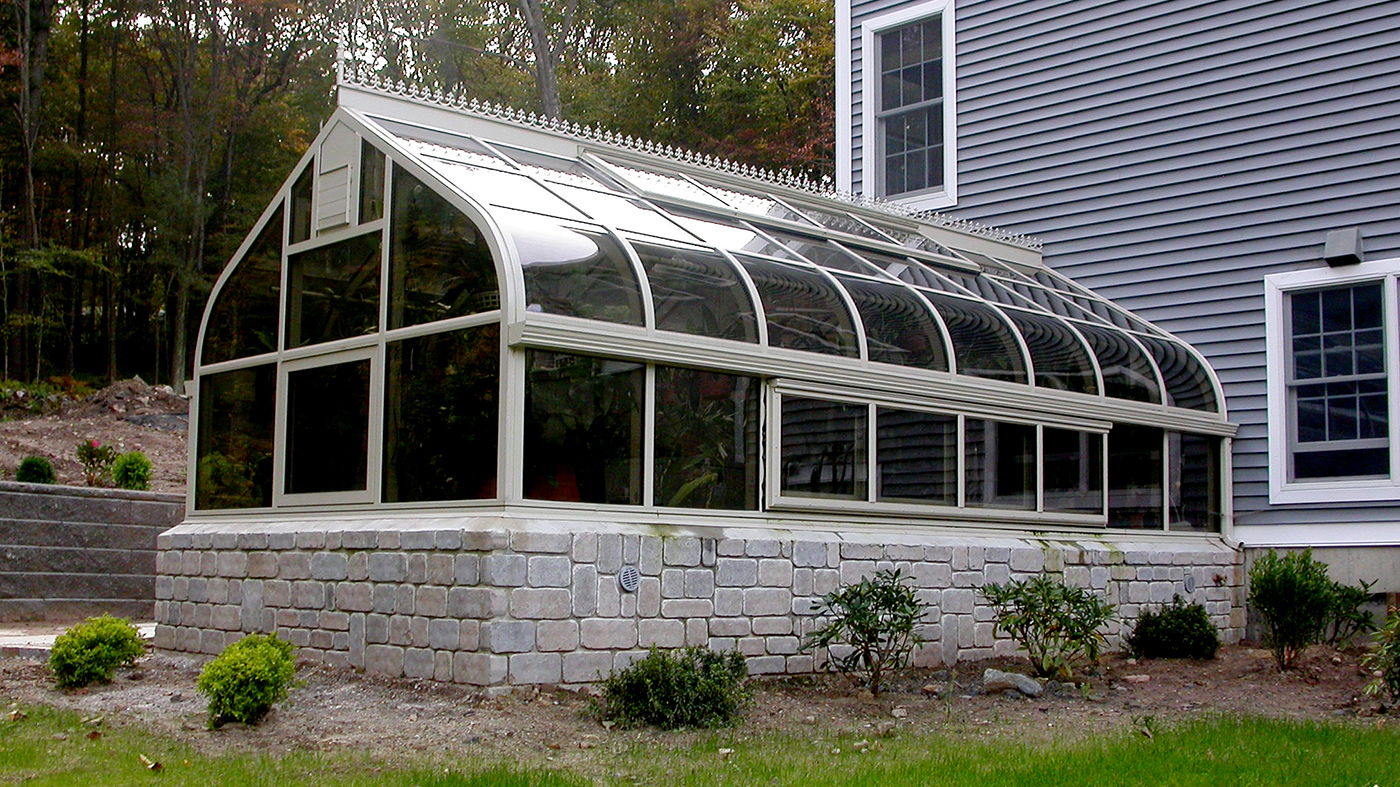 Curved eave double pitch greenhouse