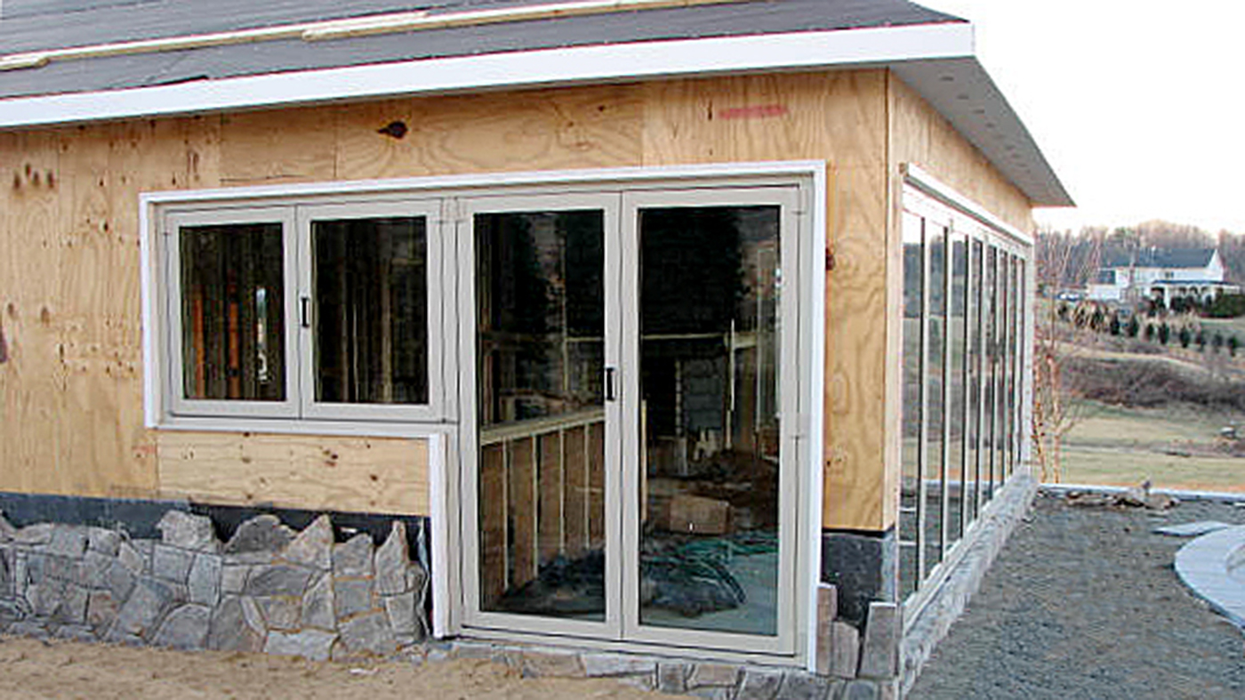 one eight-panel bifold door unit and one four-panel dual bifold door and bifold window unit, split evenly, with a floating jamb