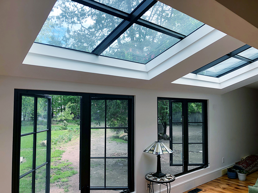Two singles slope skylights and two sets of double casement windows