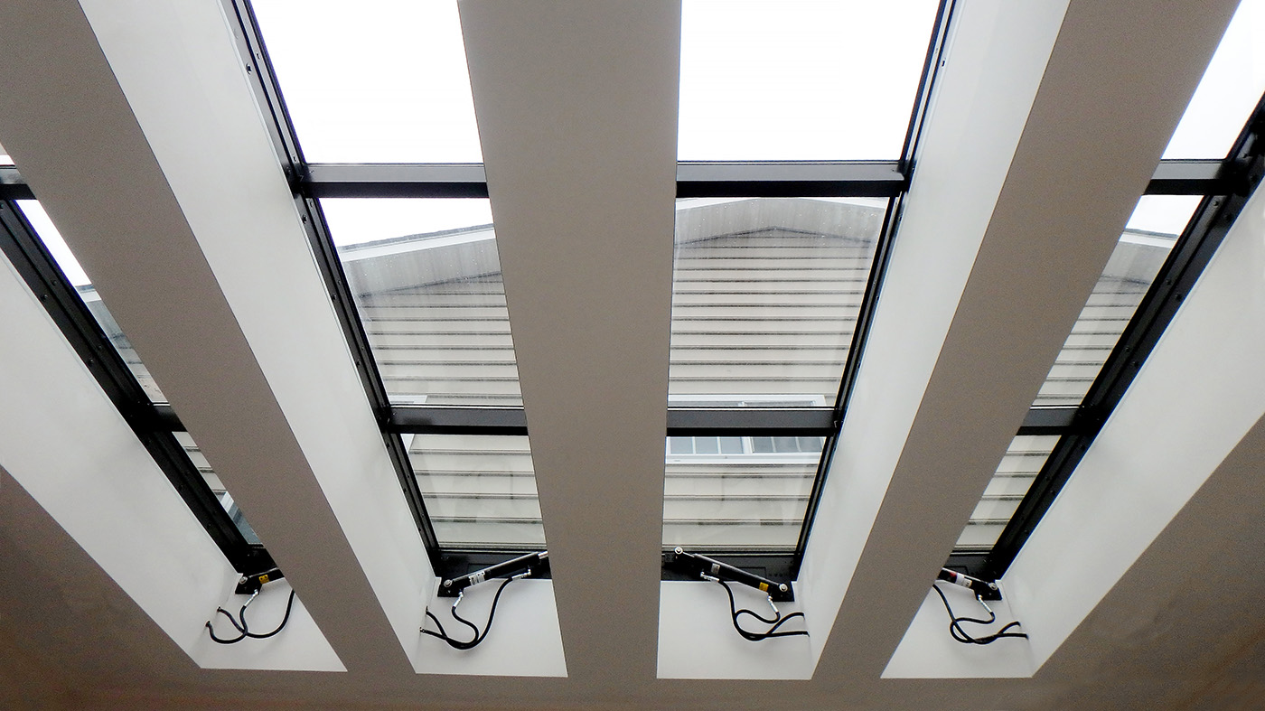 Four 80-90 degree operable skylights and one four-panel bifold door unit.