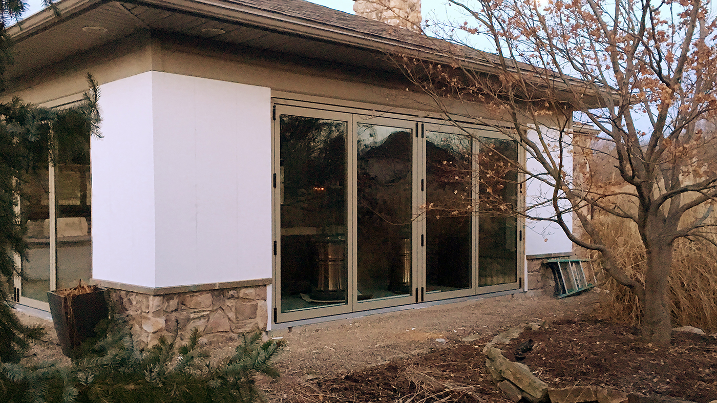 This pool house utilizes two four-panel bifold doors and one four-panel bifold window.