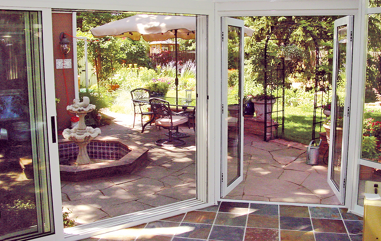 one three-panel (XXO configuration) multi-track sliding glass door unit, and one French Door unit.
