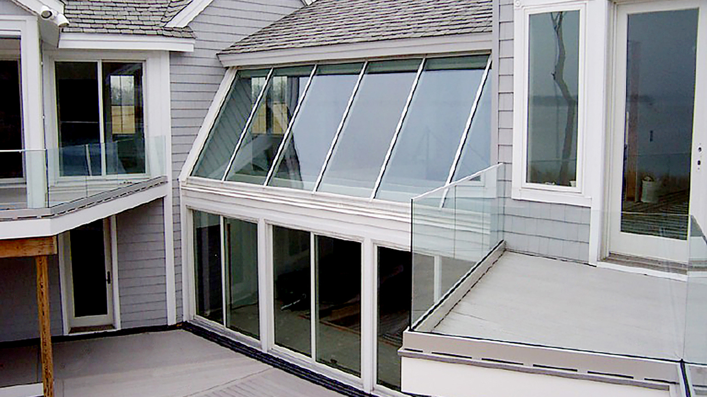 Complete glazing package, including single slope skylights, French doors, entryway roof access skylight with a terrace door, sliding glass doors, bifold windows, casement windows and a pool house.
