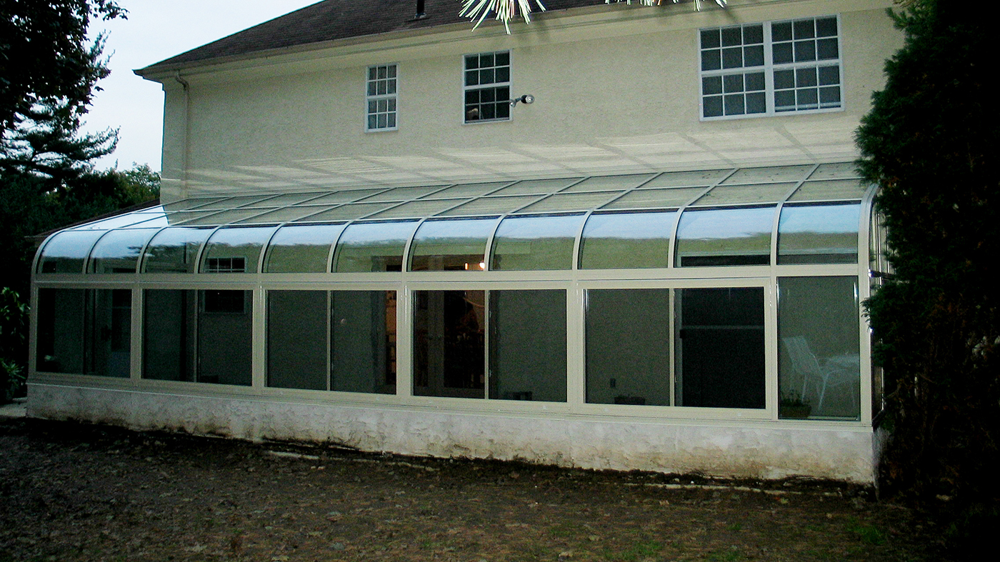 Curved eave lean to sunroom