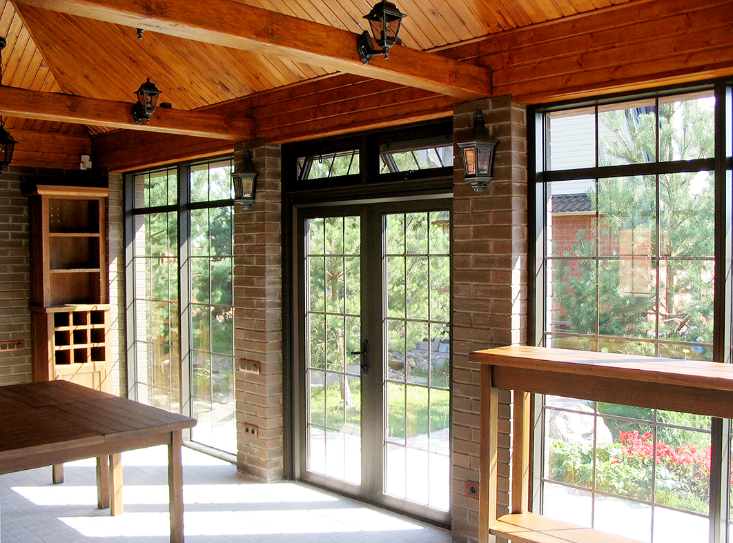 Aluminum curtain walls with integrated French doors and awning transom windows