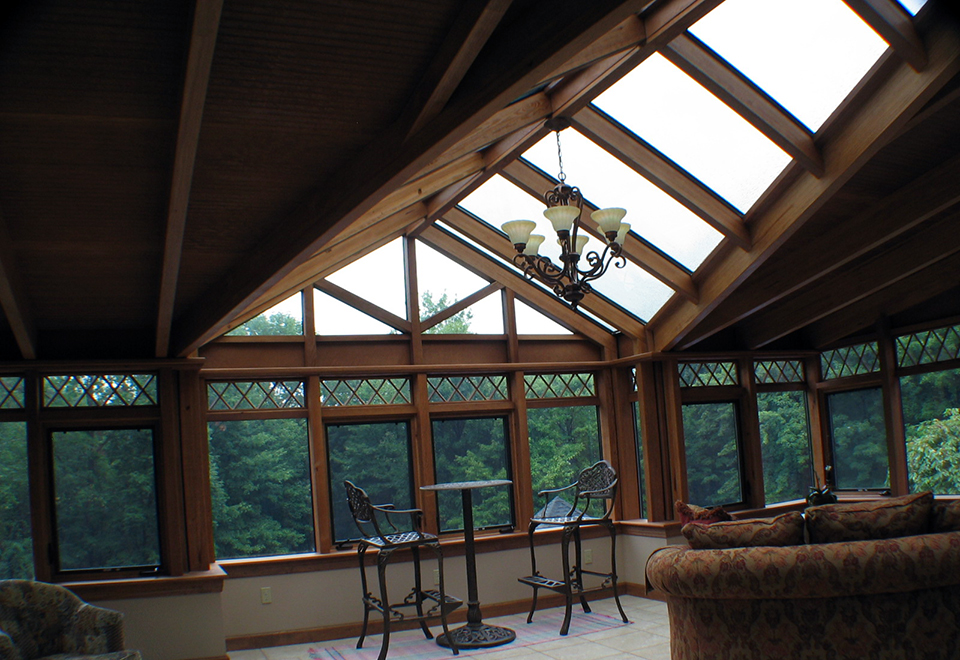 Straight eave, lean-to conservatory with double pitch dormer and aluminum exterior/Southern Yellow Pine Glulam interior