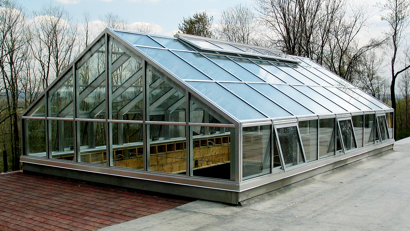 Straight eave double pitch skylight with a transom, two gable ends and awning windows