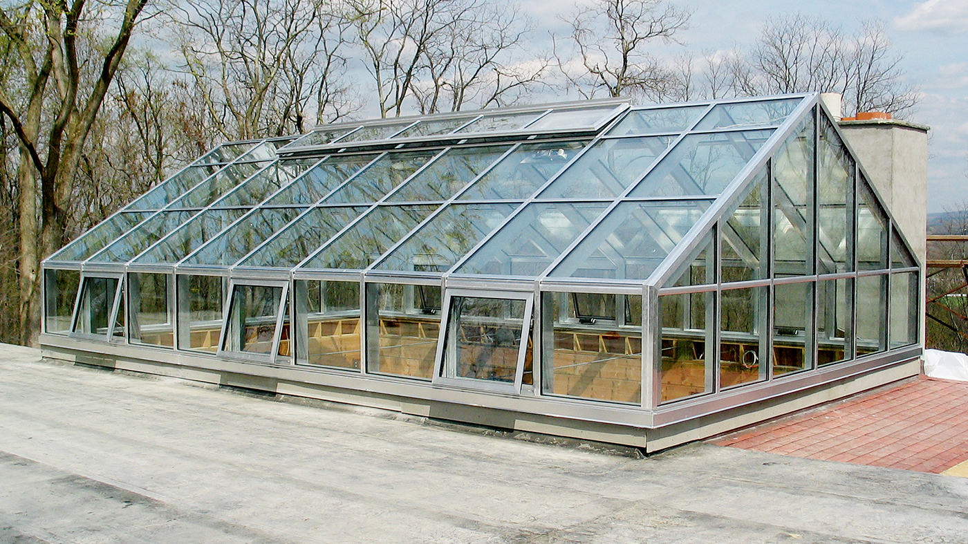 Straight eave double pitch skylight with a transom, two gable ends and awning windows
