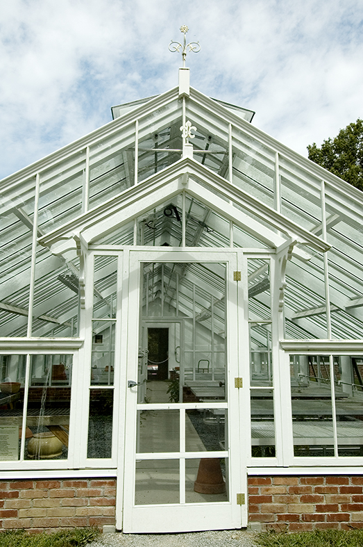 Straight eave, double pitch greenhouse with one glass partition. Attached double pitch greenhouse. Restoration System.