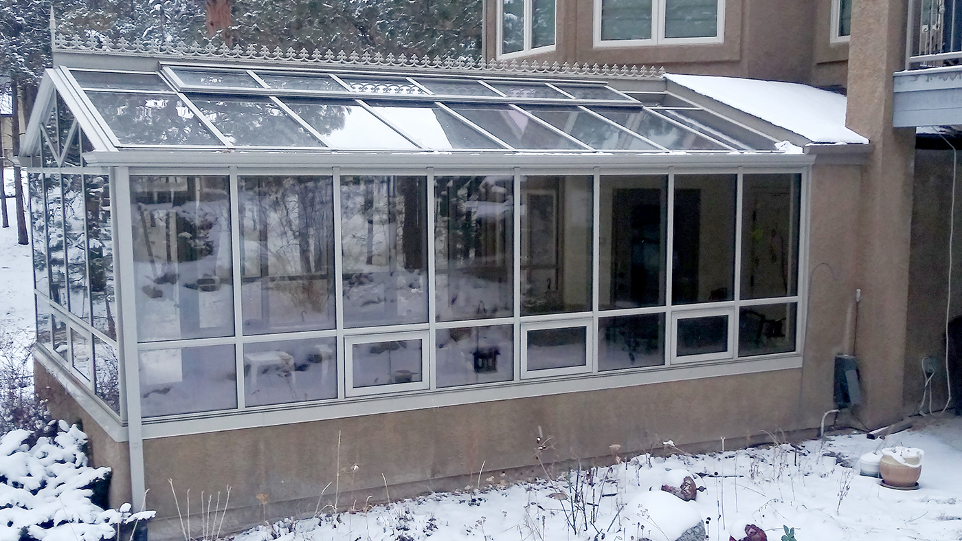 Straight eave double pitch greenhouse with one terrace door and seven awning windows