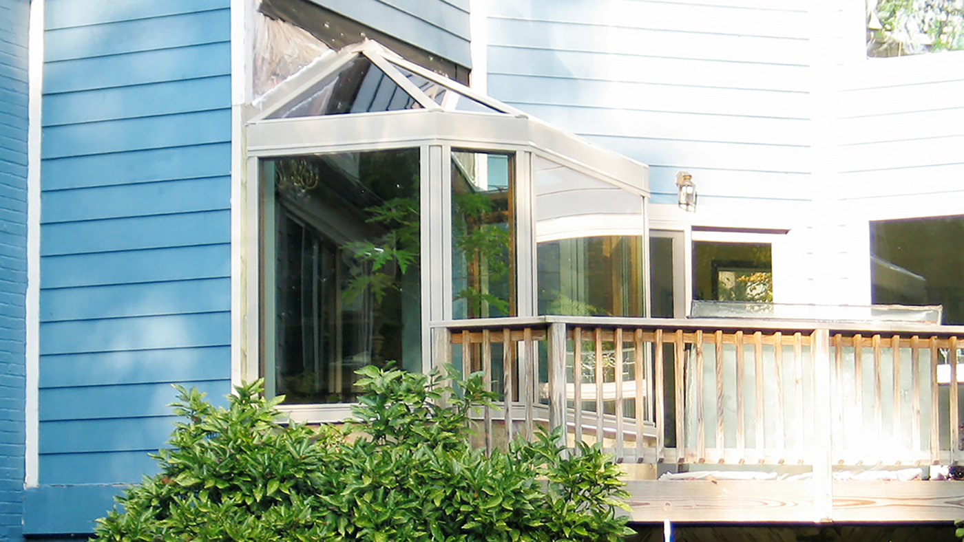 Complex conservatory nose with aluminum exterior/Mahogany interior.
