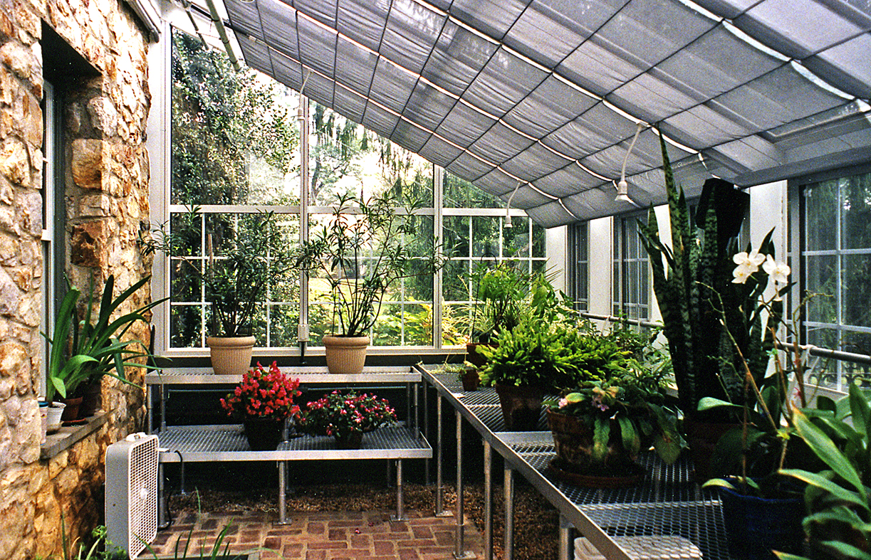 Straight eave lean-to greenhouse.