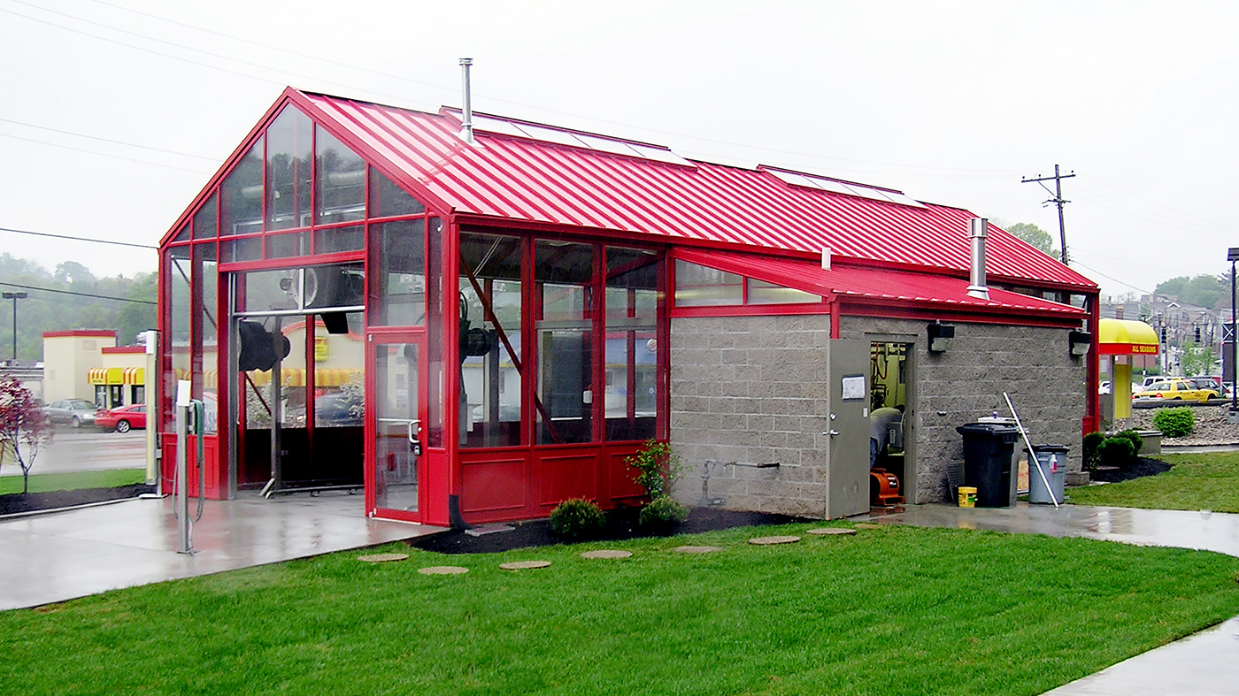 Straight eave double pitch car wash painted in red