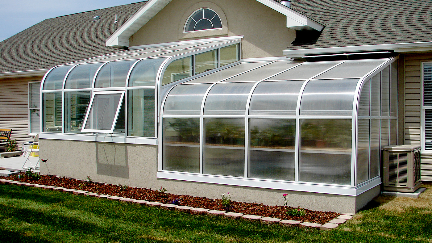 Two curved eave lean to sunrooms