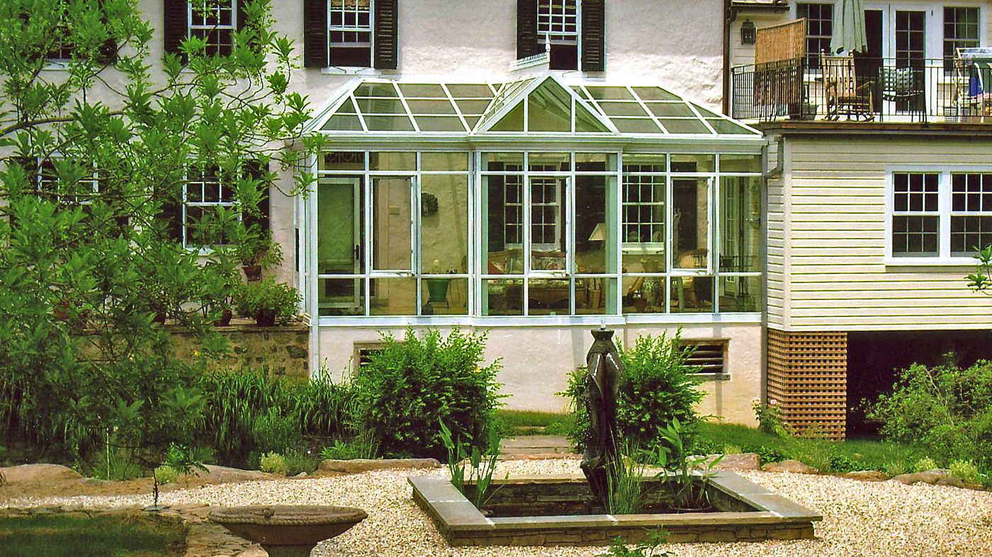 Straight eave lean-to conservatory with two irregular hip ends, and one straight eave double pitch dormer with one gable end.