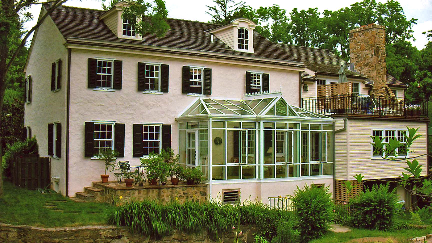 Straight eave lean-to conservatory with two irregular hip ends, and one straight eave double pitch dormer with one gable end.