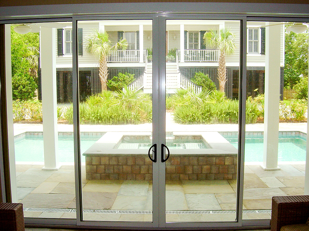 Mulitpocketed sliding glass doors on a pool house