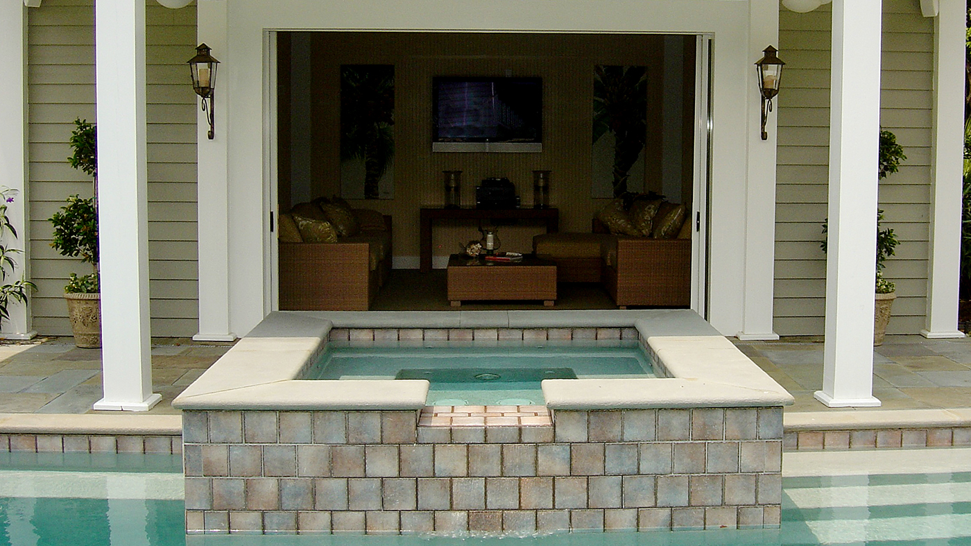 Mulitpocketed sliding glass doors on a pool house