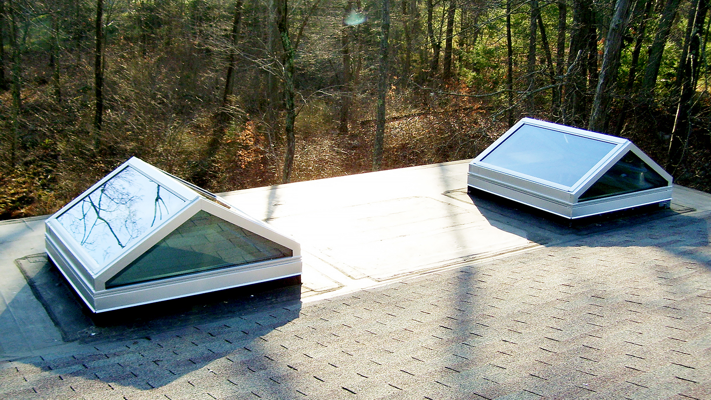 Pyramid skylight and straight eave double pitch skylights.