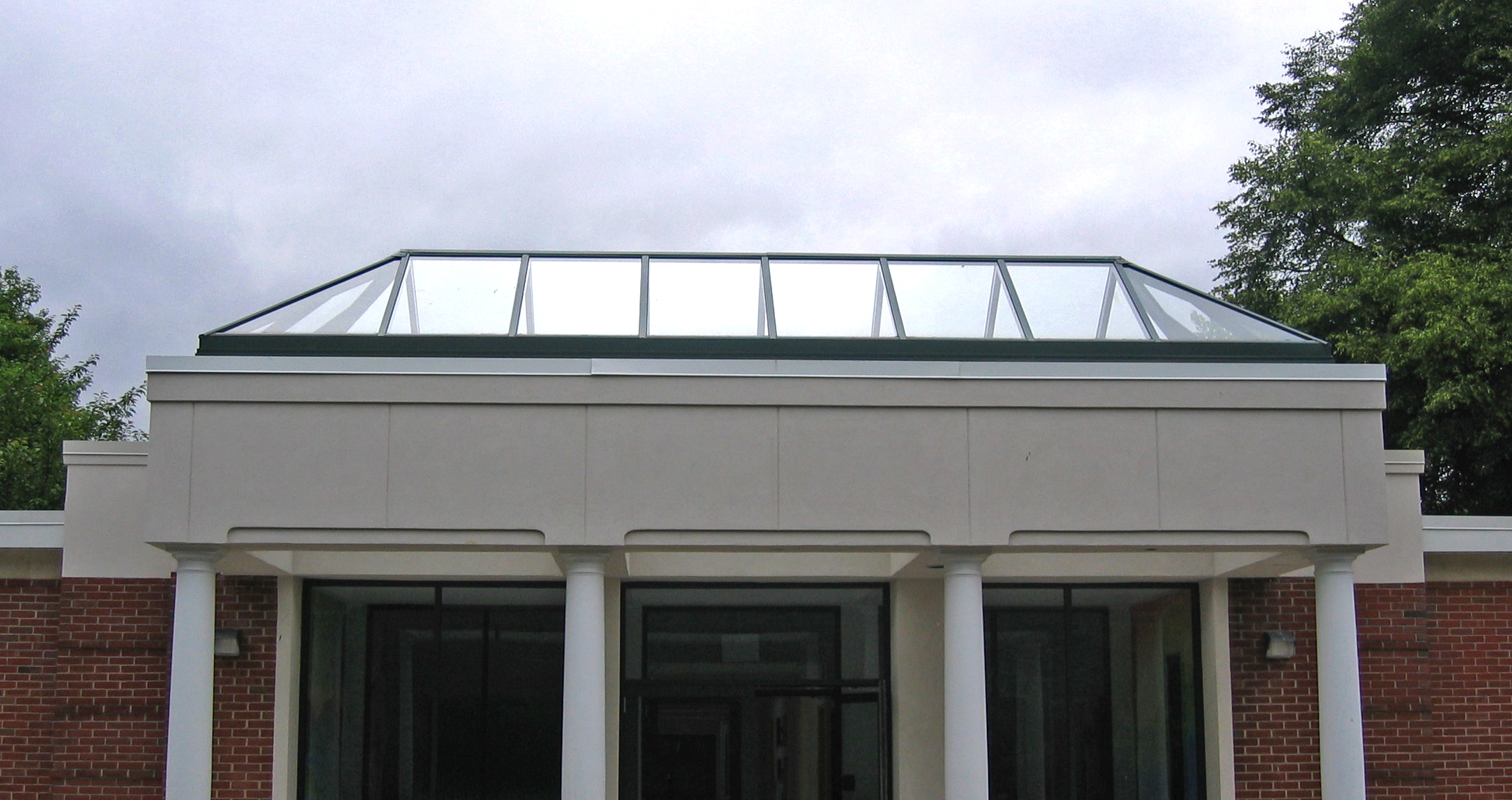 Straight eave double pitch skylight canopy.