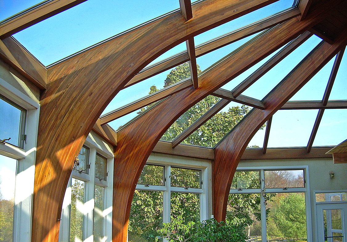 Irregular straight eave lean-to skylight with four hipped corners.