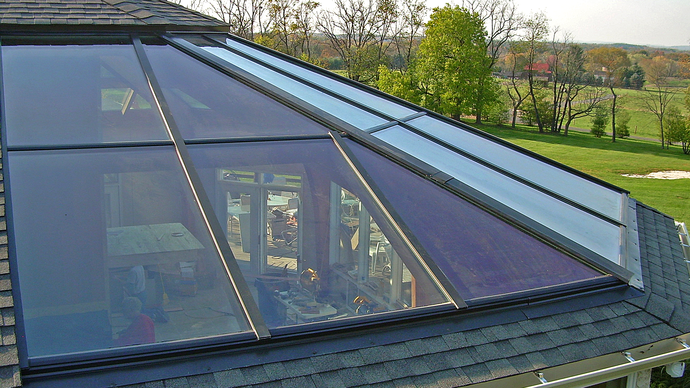 Irregular straight eave lean-to skylight with four hipped corners.