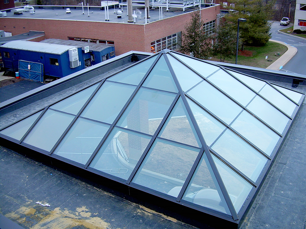 Pyramid skylight acting as canopy. Framing system is 3x6 aluminum system in Dark Bronze Anodized frame finish. Glazing is Sol-I-Guard 272.