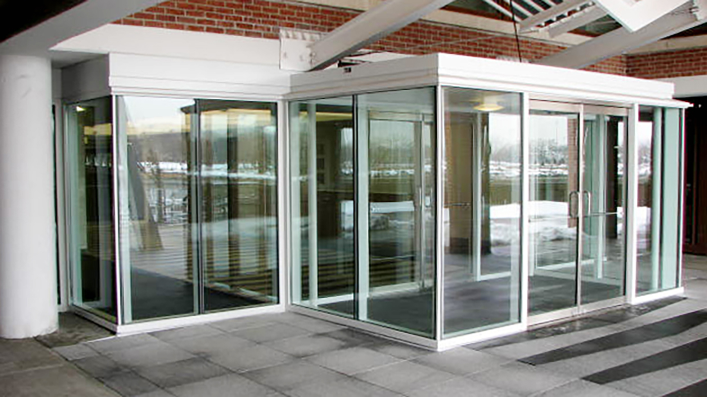 Commercial Curtain Wall and french door featuring entryway / vestibule.