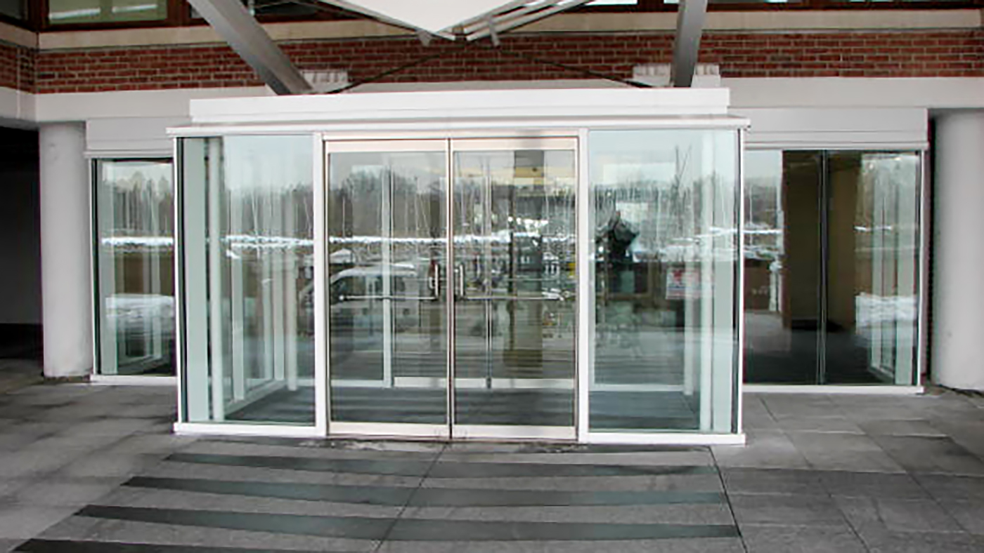Commercial Curtain Wall and french door featuring entryway / vestibule.