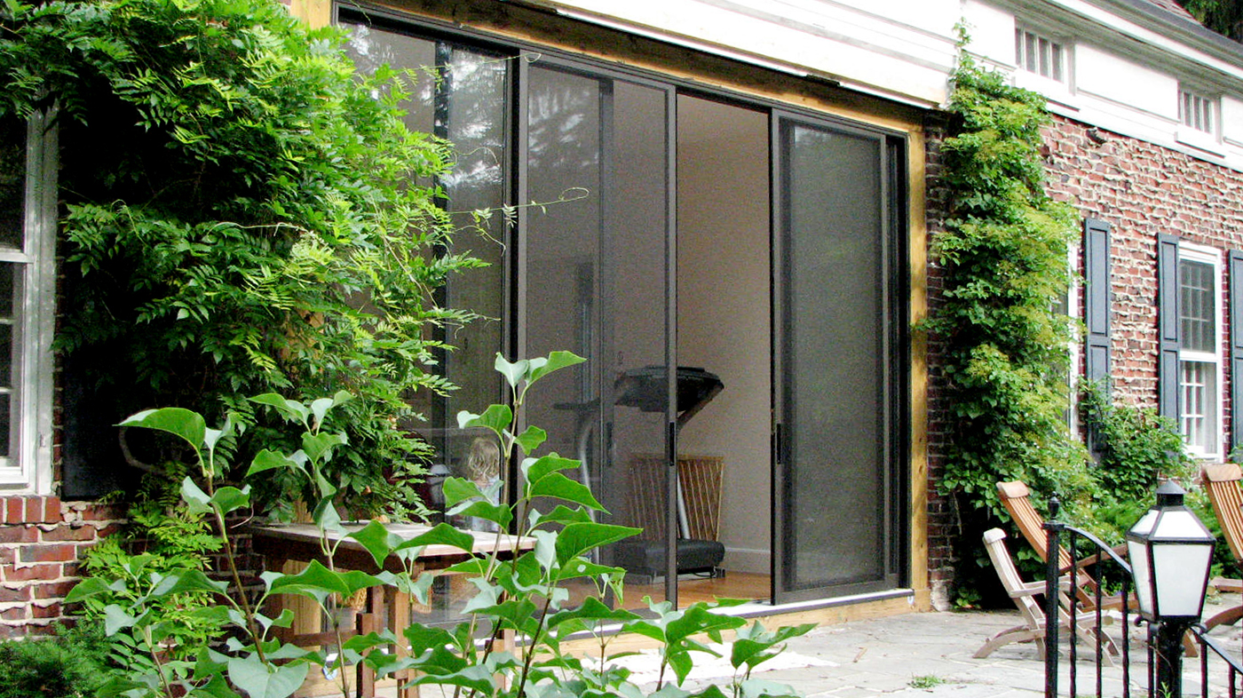 Two-bay sliding, stacking screen system with Bronze interior and exterior frame finish