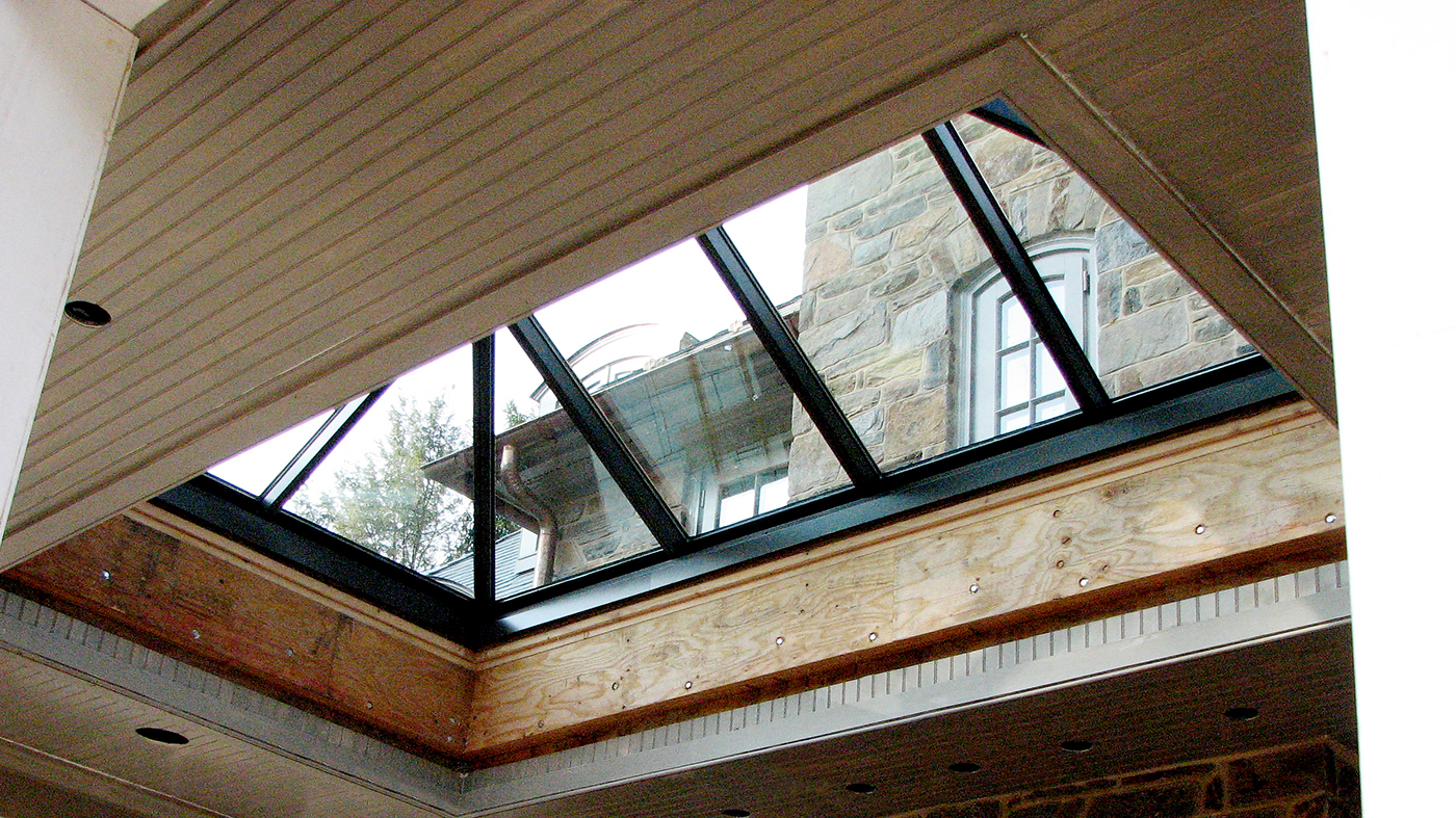 Straight eave double pitch hip end copper clad skylight