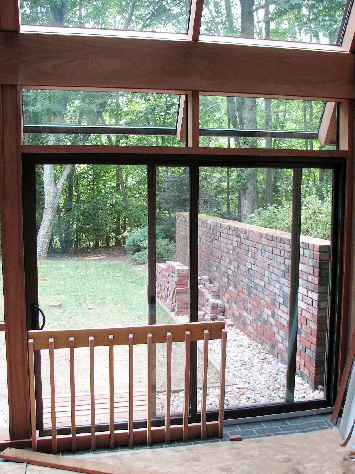 Straight eave lean-to sunroom with no gable ends, retractable exterior screens, mahongany interior, and sliding doors.Straight eave lean-to sunroom with no gable ends, retractable exterior screens, mahongany interior, and sliding doors.