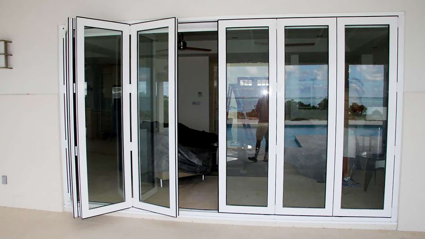 Multiple sets of folding doors and folding windows used on a residential home. Configurations include split wall, all wall, and single door hinge jamb. All units use a standard sill.