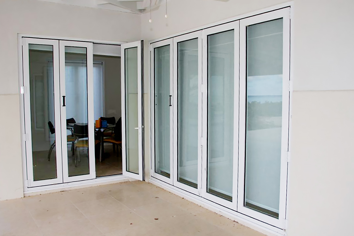 Multiple sets of folding doors and folding windows used on a residential home. Configurations include split wall, all wall, and single door hinge jamb. All units use a standard sill.