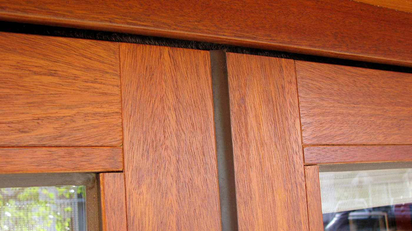 Slide and stack door with wood veneer exterior