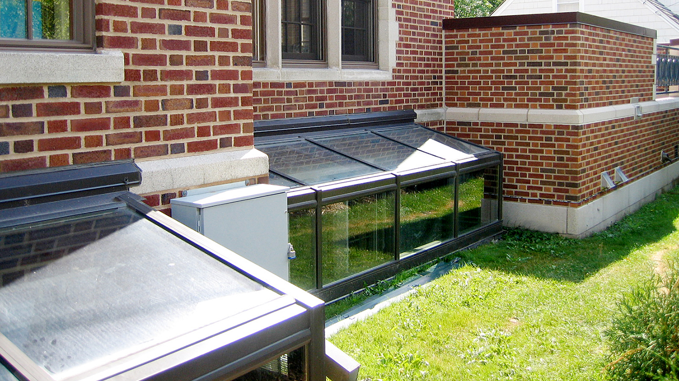 Two straight eave lean to skylights