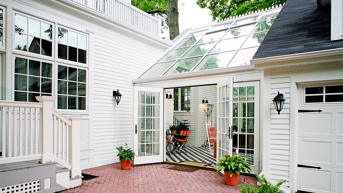 Grids enhance this sunroom that includes a straight eave, double skylight with no gable ends.