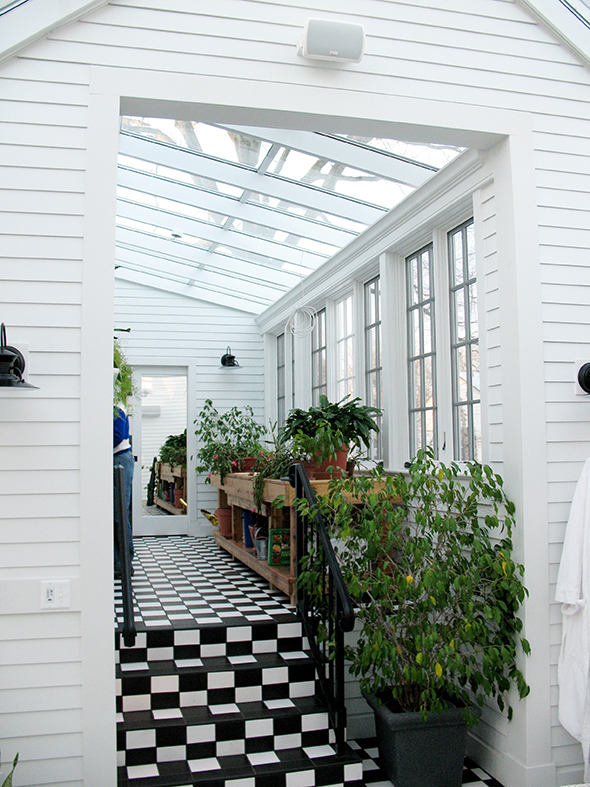 Grids enhance this sunroom that includes a straight eave, double skylight with no gable ends.