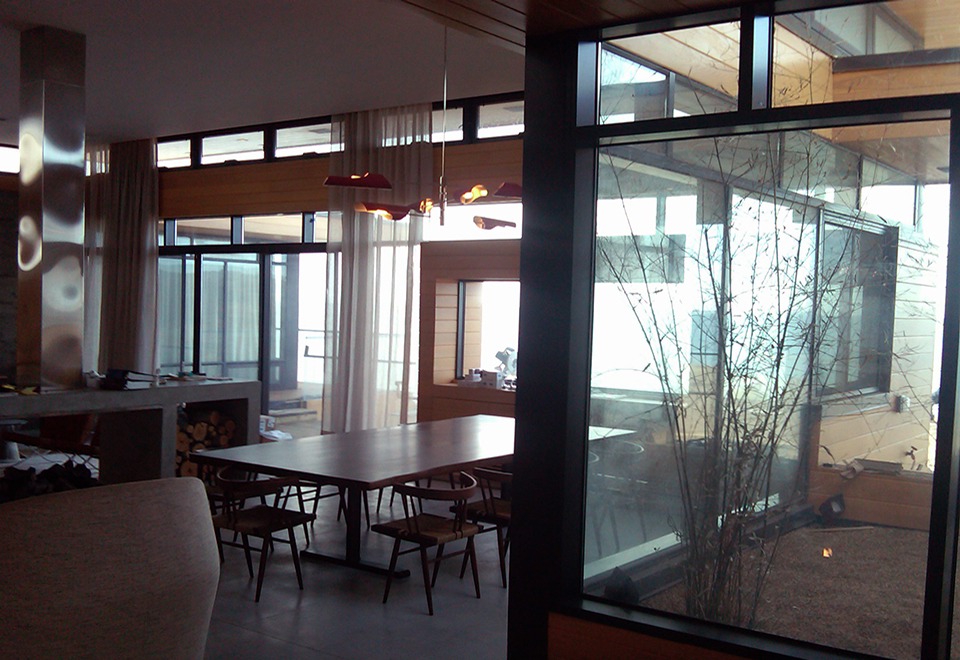 Multiple curtain wall systems throughout the home.