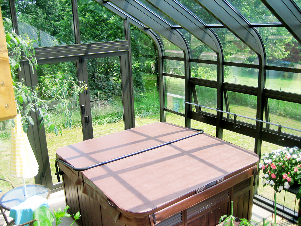 Curved Eave Lean-to spa enclosure, used to protect the customer's spa from the elements.