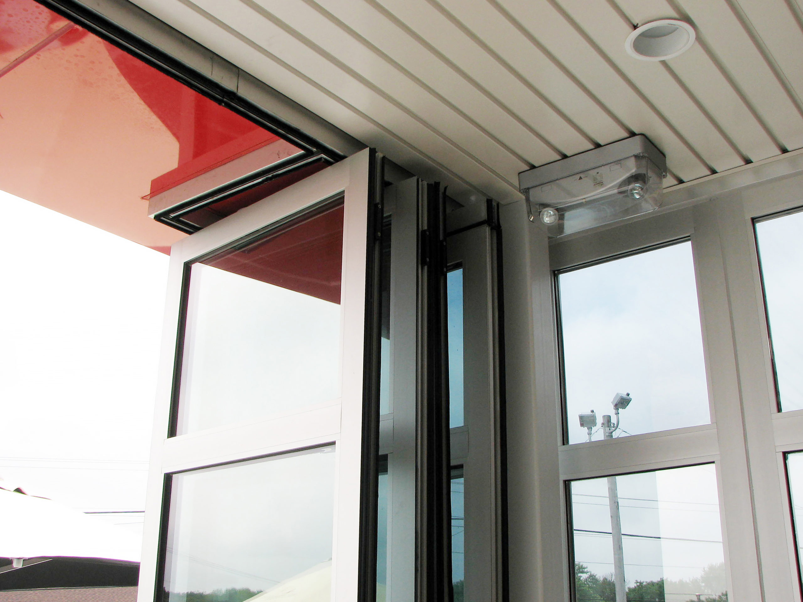 Folding glass wall system featured in clear anodized frame finish with 272 glass.