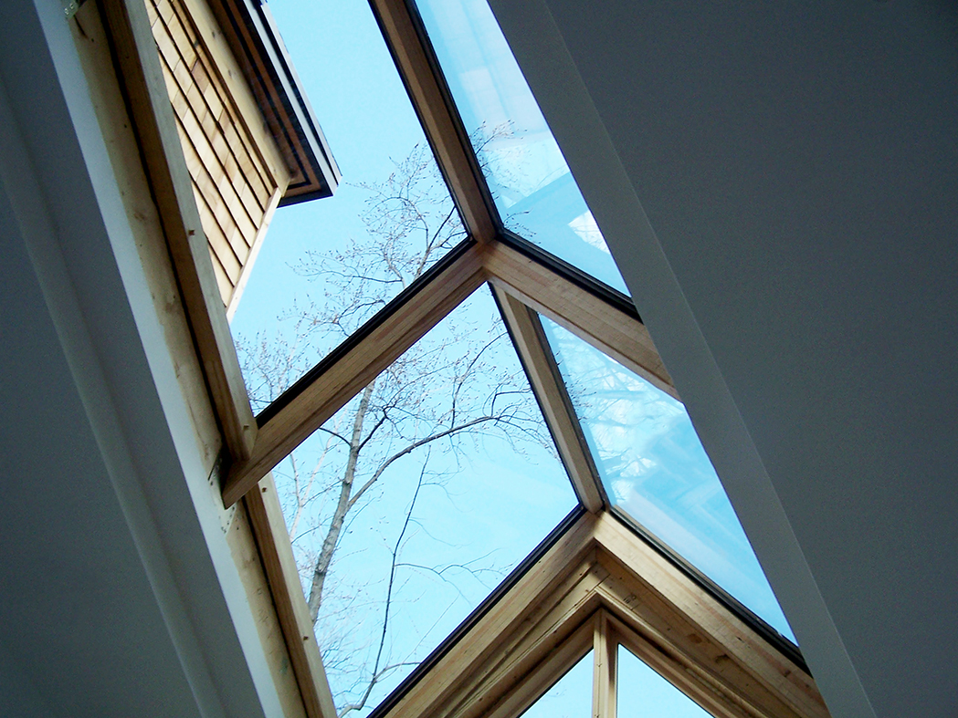 Irregular straight eave double pitch skylight with 0 gable ends and southern yellow pine interior.
