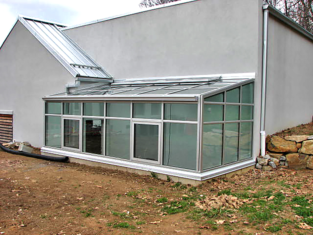 Straight eave lean-to greenhouse with 2 gable ends.