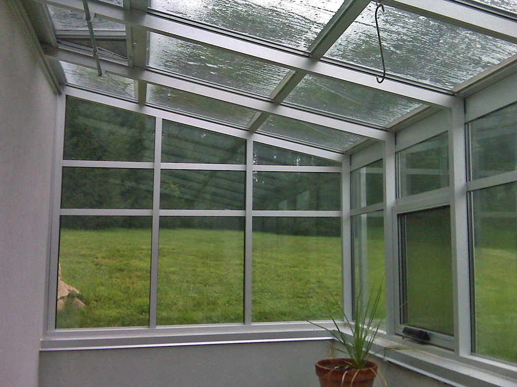 Straight eave lean-to greenhouse with 2 gable ends.