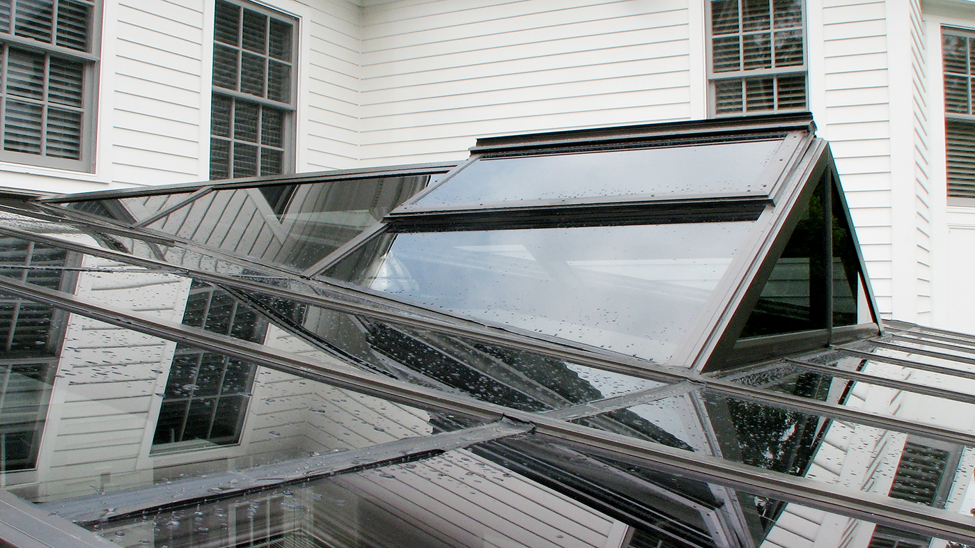 Straight eave lean to skylight with a straight eave double pitch dormer and ridge vents.