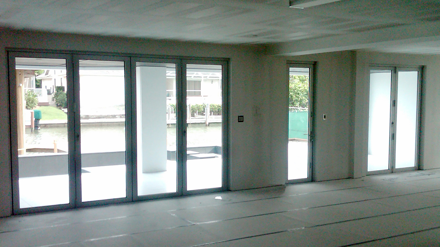 Thirteen sets of folding glass walls used on a residential home. Units consist of all wall and single door last panel configurations, along with recessed sill and impact glazing.