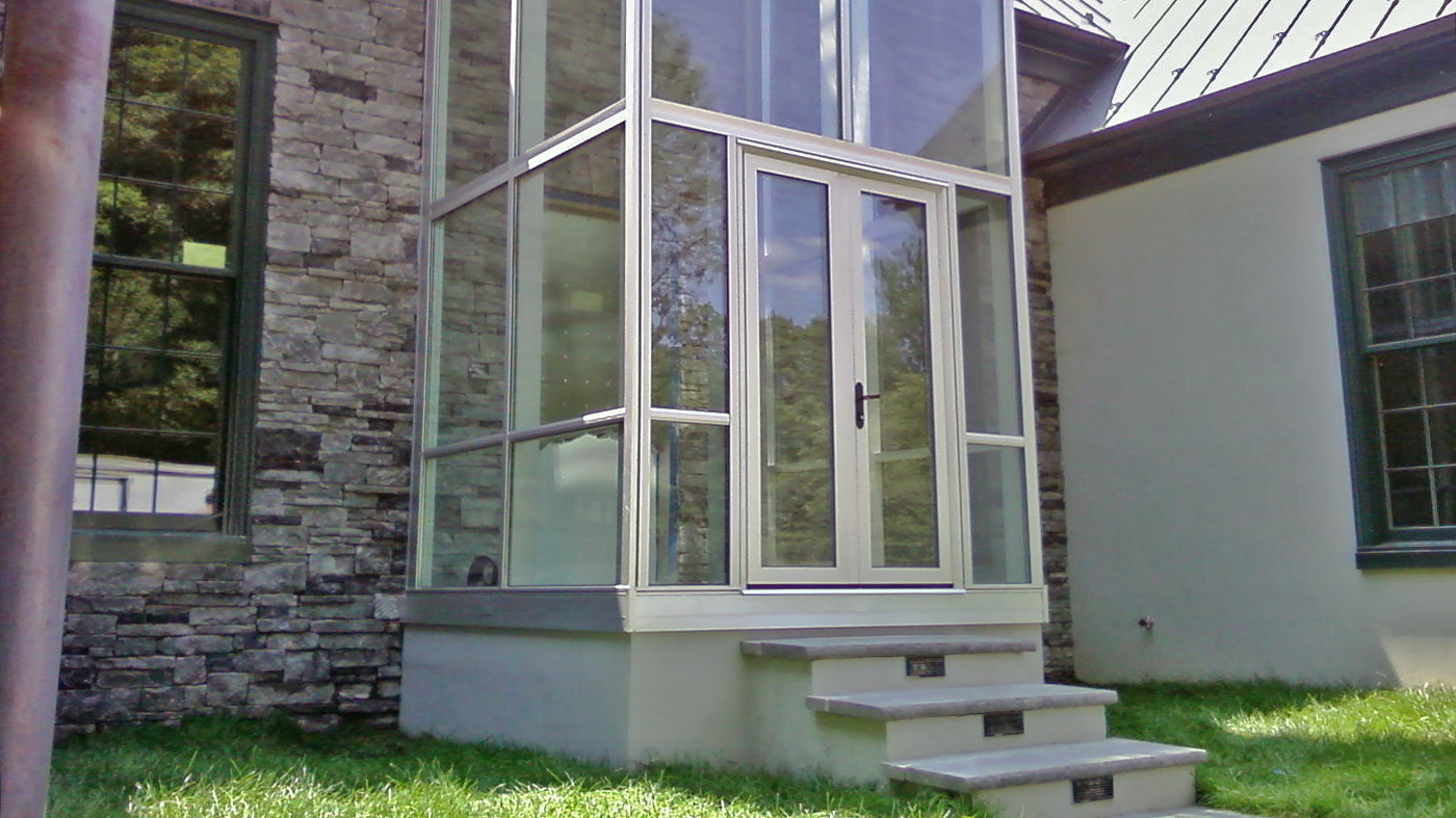 Straight eave lean-to tower with rear wall and partial front wall to connect to existing dormer roof.